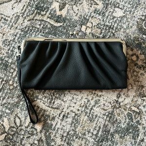 Black clutch. Never used, lots of storage!
